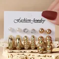Elegant gold-toned jewelry set featuring C-shaped hoops, pearl and crystal studs - Artificial Pearl Rhinestone Ball Set (TZ026) / 6 Pairs Set / Gold