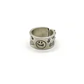 Close-up of retro 925 sterling silver ring with engraved smiley face and dollar sign patterns - Adjustable Open / Vintage Distressed Smiley Dollar Style (J2127)