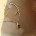 Detailed view of an elegant green agate teardrop pendant on a 925 sterling silver chain - Green Agate Water Drop Style / Silver (0092)