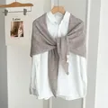 Minimalist brown marled knitted triangular shawl scarf for women styled on white shirt - Khaki