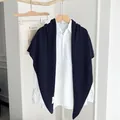 Navy blue knit triangle shawl scarf over white shirt for women minimalist style. - Navy Blue