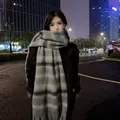 Thick striped mohair-like warm scarf shawl for winter shown in an urban night scene. - 40x230cm / Mohair Striped Grey