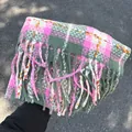 Cozy pink and green plaid scarf with tassels for winter warmth and style. - Pink and Green Plaid