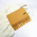 Mustard yellow faux cashmere scarf with elegant tassels and a small black woven label - 70-200cm / Turmeric