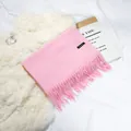 Soft pink faux cashmere scarf with long tassels and small label for cozy winter styling - 70-200cm / Hot Pink