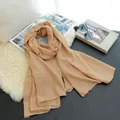 Elegant solid peach cotton linen long scarf for women with lifestyle props - Camel