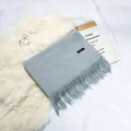 Elegant grey faux cashmere scarf with soft fringes and minimalist black label detail - 70-200cm / Light Gray