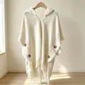 Elegant cream white knitted hooded poncho with fringe tassels and button details for women - Tops / Hooded Beige