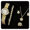 Detail view of luxury women's jewelry set including a gold-tone watch, necklace, and ring. - Three-Stone Square Set (No Box) / Gold