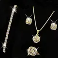 Macro detail of luxury gold-toned zircon necklace, bracelet, earrings, and ring set - Gold Single Row Bracelet + Gold Square Necklace Ring Earrings Four-Piece Set