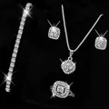 Macro detail of luxury silver zircon jewelry set including necklace, ring, and bracelet. - Silver Single Row Bracelet + Silver Square Necklace Ring Earrings Four-Piece Set