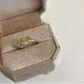 Detail of a light luxury green square stone ring presented in a velvet jewelry box - Grape Green (J3083)