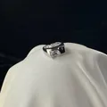 Modern silver-finish adjustable ring featuring a large rectangular clear cubic zirconia - Silver Geometric Wide Band Clear Square Stone Style / Silver Wide Band (J3169)