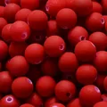 Macro detail of 8mm matte red acrylic spacer beads for DIY Christmas jewelry crafts - 1800 Pieces/Pack (500g) / Bright Red