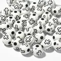 Close-up of 8mm white acrylic beads featuring black cross patterns for DIY crafts - 1800 Pieces/Pack / White Base Black Line