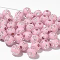 Detailed macro view of 8mm pink acrylic round beads featuring metallic silver cross pattern - 1800 Pieces/Pack / Silver Line Pink
