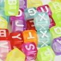 Close-up of 6mm colorful acrylic cube alphabet beads for DIY jewelry making. - Transparent Multicolor With White Letters