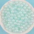 Macro detail of 8-10mm light blue AB iridescent acrylic beads for DIY jewelry crafting - 8mm / Light Blue AB Color / 1800 Pieces/500g