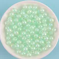 Detailed macro view of mint green AB iridescent acrylic beads for DIY jewelry making crafts - 8mm / Lake Blue AB Color / 1800 Pieces/500g