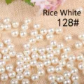 Close-up view of lustrous creamy white acrylic pearl beads for DIY jewelry making accessories - 8mm / Pearl Beige