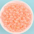 Close-up of peach AB color acrylic beads for DIY handmade jewelry crafts - Orange Yellow AB Color