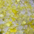 Detailed macro view of mixed yellow and iridescent acrylic flower and leaf beads for DIY. - 500g Pack (Approx. 800 Pieces) / Yellow