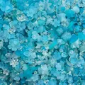 Macro detail of mixed blue acrylic flower and leaf beads for DIY jewelry making - 500g Pack (Approx. 800 Pieces) / Lake Blue