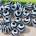 Close-up of zebra pattern acrylic round beads for DIY jewelry making - 520 Pieces/Pack / 12mm / Black and White