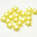 Close-up of yellow star acrylic beads with white star inner core for DIY crafts - Star Shape / 500g Pack / Yellow