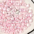 Close-up detail of 8mm pink heart-shaped faux pearl beads for DIY jewelry making. - 2500颗装(8mm) / Pink
