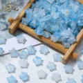 Macro detail of blue frosted star beads with gold foil for DIY jewelry making. - 200 Pieces/Pack / Blue