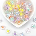 Macro view of colorful 12mm transparent acrylic flower beads for DIY crafts - 12mm / Five-Petal Plum Blossom Style / 1000 Pieces/Pack / Multicolor