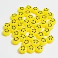 Detail view of 10mm yellow acrylic beads with black smiley face prints for DIY crafts. - Smiley Face (6x10 mm Round Smiley Face) / 1600 Count / Yellow with Black Web