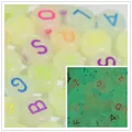 Macro detail of 7mm luminous acrylic letter beads showing glow-in-the-dark effect. - 4000 Pieces/Pack / Luminous Colorful Letters