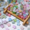 Close-up of colorful matte pentagram frosted beads with gold foil for DIY jewelry - 200 Pieces/Pack / Multicolor