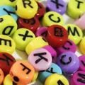 Macro shot of 7mm colorful acrylic alphabet beads for DIY jewelry making and crafts - 4000 Pieces/Pack / Colorful with Black Letters