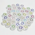 Detail view of 10mm clear acrylic beads with colorful smiley faces for DIY jewelry crafts. - Smiley Face (6x10 mm Round Smiley Face) / 1600 Count / Transparent Background Colorful Line