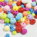 Macro view of various colorful acrylic round beads with holes for DIY jewelry making - 4mm / Multicolor