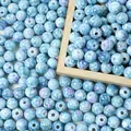 Detailed view of 8mm blue acrylic crackle beads with a speckled ceramic effect - 8mm (Approx 1800 Pieces/500g) / Light Blue