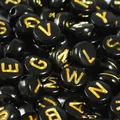 Macro detail of 7mm black acrylic beads with golden engraved alphabet letters for DIY jewelry - 4000 Pieces/Pack / Black With Gold Text