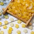 Detailed view of yellow matte star-shaped beads with gold foil for DIY jewelry crafts - 200 Pieces/Pack / Yellow