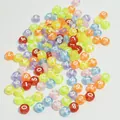 Macro view of colorful 7mm acrylic beads with white printed numbers 0 to 9 - 4000 Pieces/Pack / Clear White Text