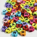 Close-up of colorful 7mm heart-shaped acrylic alphabet beads for DIY jewelry - 3800 Pieces/Pack / Colorful Base Black Line