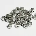 Detail view of silver metallic smiley face acrylic beads for DIY jewelry making and crafts - Silver Smiley Face Style / 1300 Pieces/Pack (10mm) / Silver Base With Black Lines