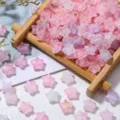 Macro view of frosted star beads with gold foil specks displayed on a bamboo tray - 200 Pieces/Pack / Pink Purple