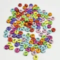 Macro view of colorful 7mm acrylic round beads with printed numbers 0 to 9 - 4000 Pieces/Pack / Colorful Base Black Line