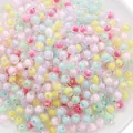 Detailed view of colorful 8-10mm bead-in-bead acrylic spheres for DIY jewelry crafting - Glossy Mixed Colors