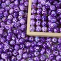 Macro detail of 8mm purple acrylic crackle beads with faux ceramic splatter effect - 500g/8mm/1800 Pieces/Pack / Purple