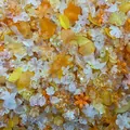 Macro view of mixed iridescent acrylic flower and leaf beads for DIY jewelry accessories - 500g Pack (Approx. 800 Pieces) / Orange