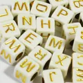 6mm white acrylic square alphabet beads featuring gold letters for DIY jewelry making - White with Gold Print